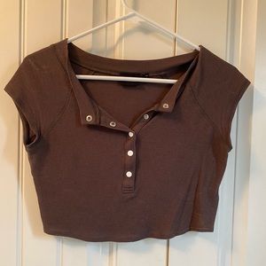 Out from under brown top